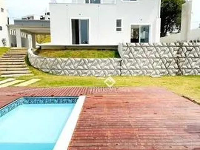 Imagem: A casa em condomínio possui 4 Dormitórios, 3 Suítes, 5