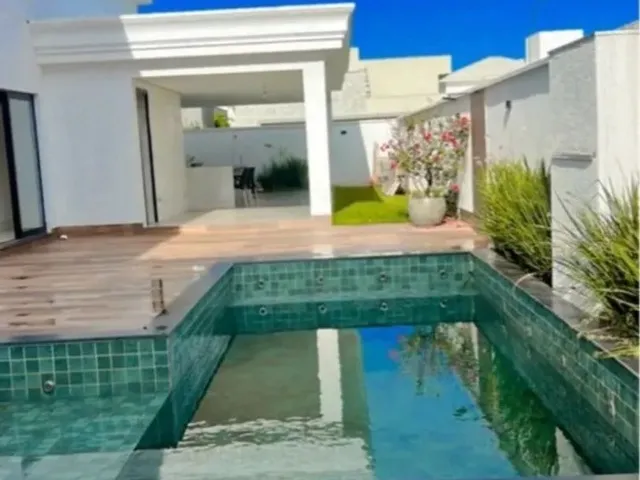 Imagem: A casa possui 4 Dormitórios, 4 Suítes, 5 Banheiros, 4 Vagas