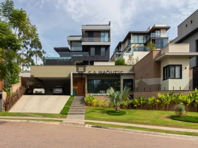 Imagem: A casa em condomínio possui 3 Dormitórios, 3 Suítes, 4