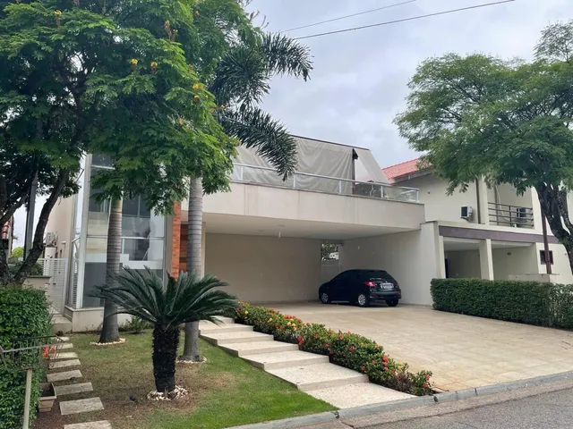 Imagem: A casa em condomínio possui 5 Dormitórios, 4 Suítes, 6