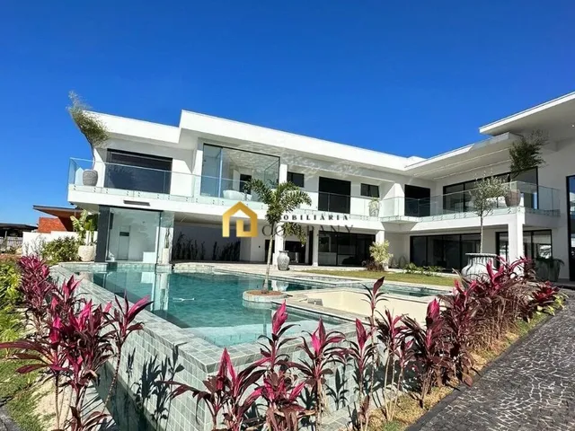 Imagem: A casa em condomínio possui 4 Dormitórios, 4 Suítes, 6