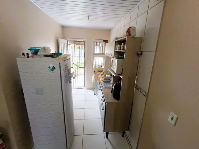Imagem 3: Imóvel à venda em Canoas: Casa com banheiro social, sala de estar e cozinha no Parque