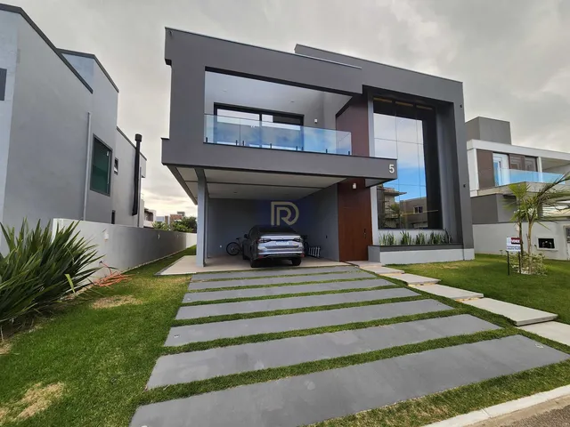 Imagem: A casa possui 4 Dormitórios, 4 Suítes, 2 Vagas na