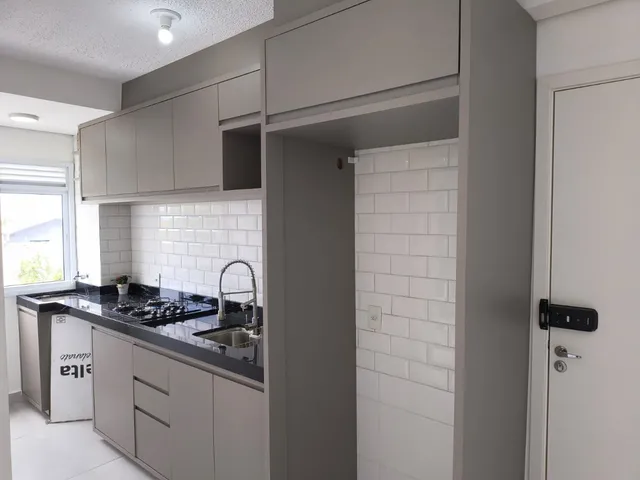 Imagem: O apartamento possui 2 Dormitórios, 1 Banheiro, 2 Vagas na