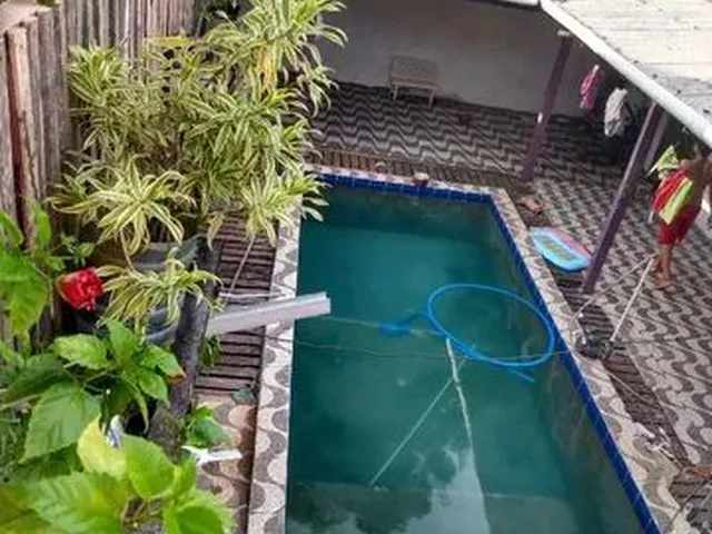 Imagem: A casa possui 3 Dormitórios, 2 Banheiros, 2 Vagas na