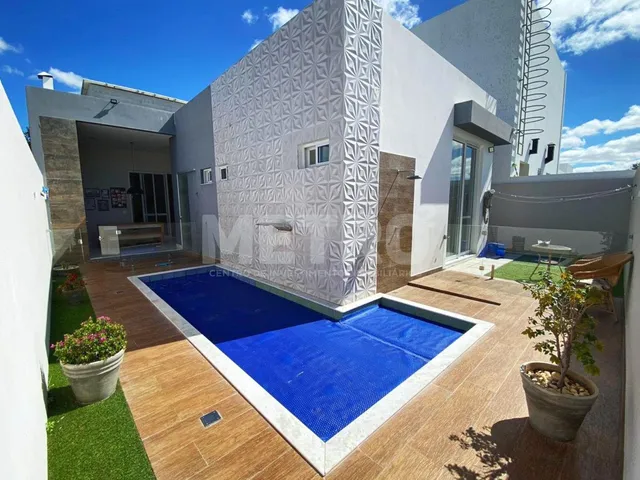 Imagem: A casa em condomínio possui 3 Dormitórios, 3 Suítes, 4