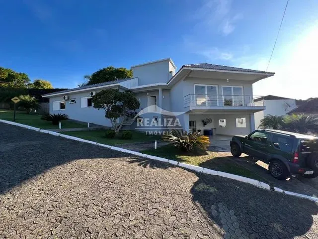 Imagem: A casa em condomínio possui 3 Dormitórios, 2 Suítes, 4