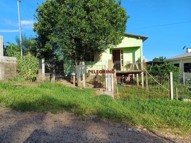 Imagem: A casa possui 3 Dormitórios, 1 Banheiro, 1 Vaga na