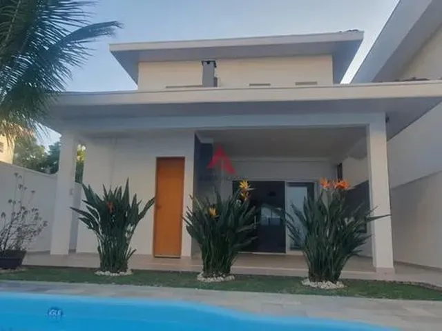 Imagem: A casa em condomínio possui 3 Dormitórios, 3 Suítes, 4