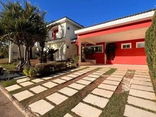 Imagem: A casa em condomínio possui 4 Dormitórios, 4 Suítes, 5