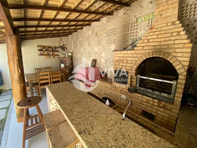 Imagem 3: Ampla casa de alto padrão com 4 suítes e 3 vagas de garagem na Nova Guarapari