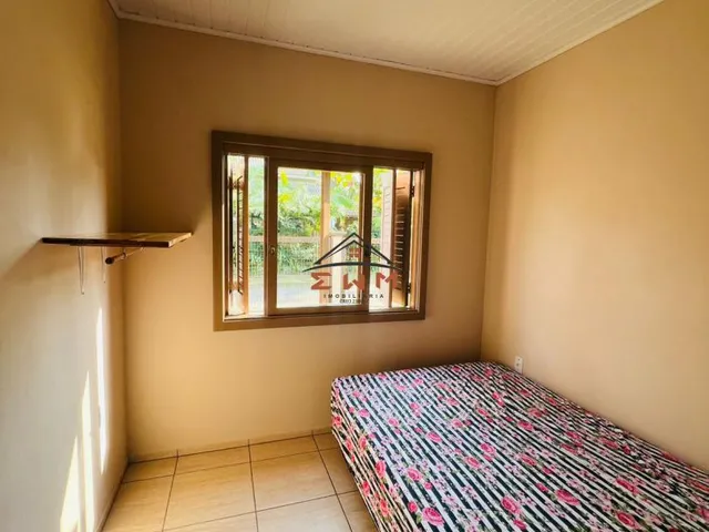 Imagem 3: Casa de esquina toda Mobiliada à venda em Torres - 4 Dormitórios, Churrasqueira e