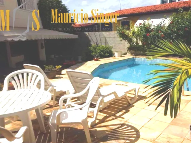 Imagem: A casa em condomínio possui 5 Dormitórios, 4 Suítes, 6
