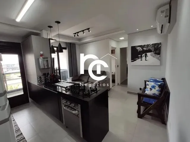 Imagem: O apartamento possui 2 Dormitórios, 1 Suíte, 1 Banheiro,