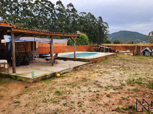Imagem 11: Casa com 3 dormitórios, 2 banheiros, sala de estar social integrada com a cozinh