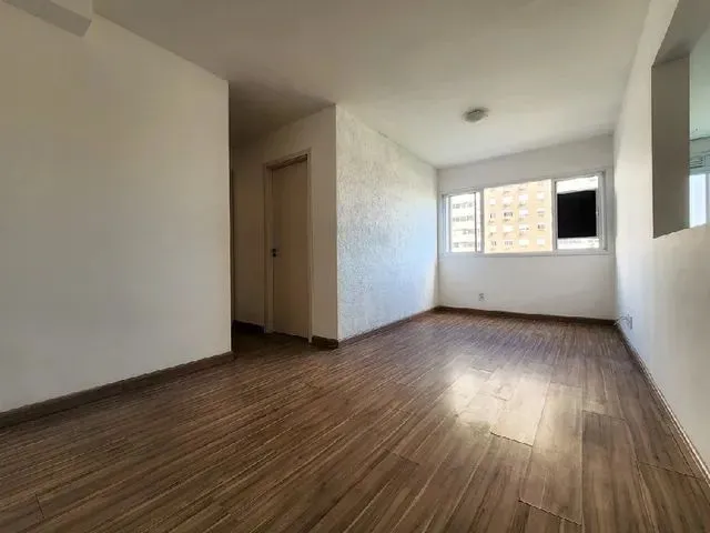 Imagem: O apartamento possui 2 Dormitórios, 1 Suíte, 2 Banheiros,