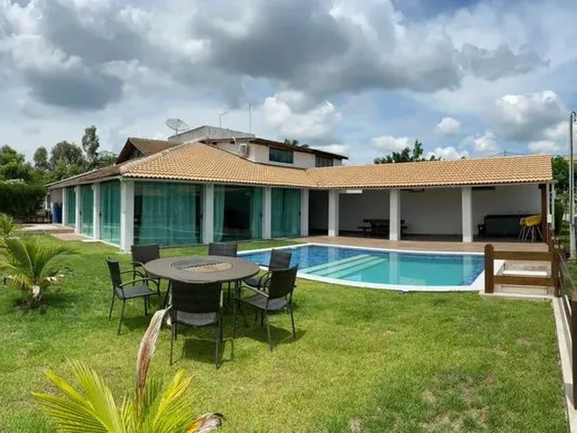 Imagem: A casa em condomínio possui 4 Dormitórios, 4 Suítes e