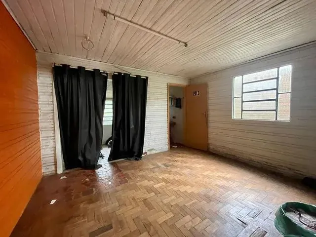 Imagem 7: Um Terreno com Uma Casa Simples