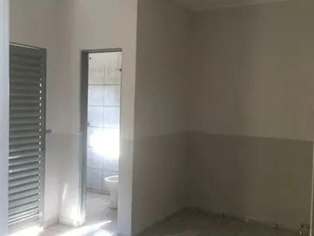 Imagem 3: Suíte com Cozinha Integrada e Área de Serviço (Kitnet