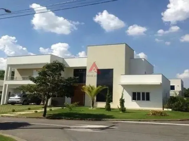 Imagem: A casa em condomínio possui 4 Dormitórios, 4 Suítes, 5