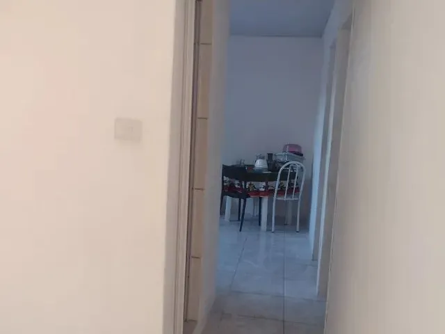 Imagem 2: Casa. Área de serviço, 1 Banheiroe2 Dormitórios