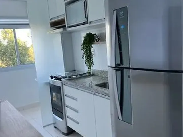 Imagem: O apartamento possui 2 Dormitórios, 1 Banheiro, 2 Vagas na