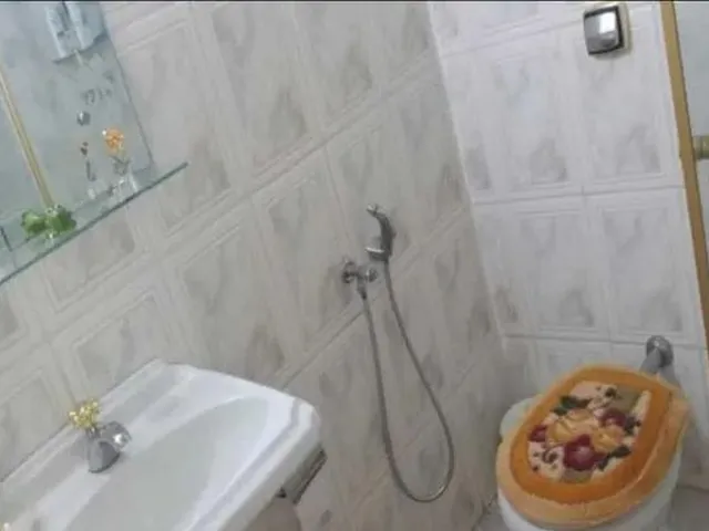 Imagem 4: Casa em Rua Tranquila, com 3 Quartos e 4 Vagas de Garagem