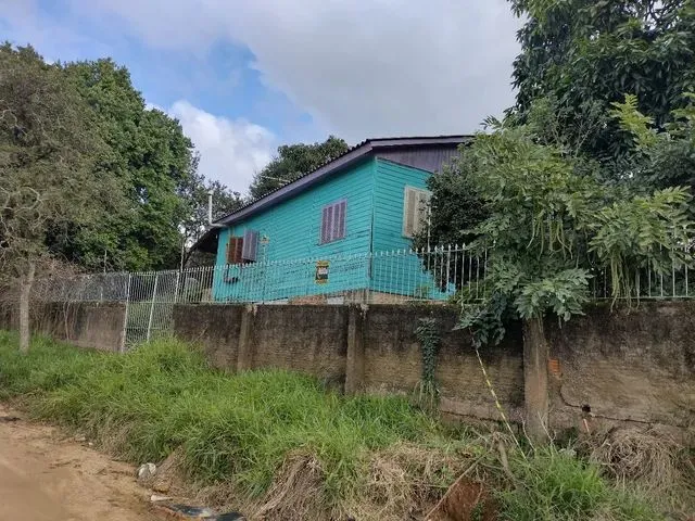 Imagem: A casa possui 2 Dormitórios, 1 Banheiro, 1 Vaga na