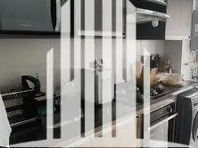 Imagem: O apartamento possui 2 Dormitórios, 1 Suíte, 2 Banheiros,