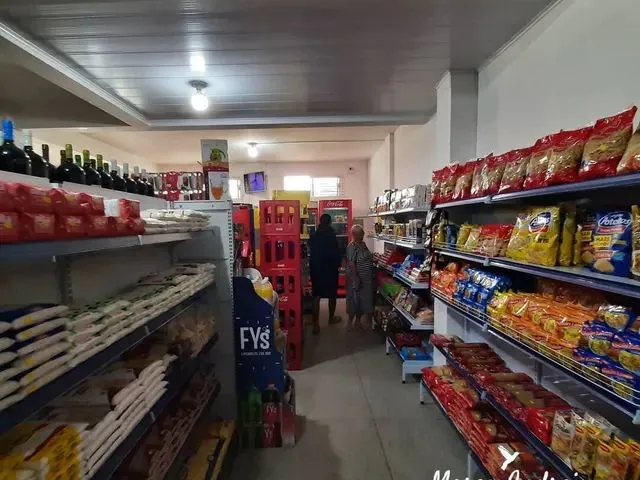 Imagem 8: Investimento, Prédio com Moradia e Mercado em Pleno Funcionamento