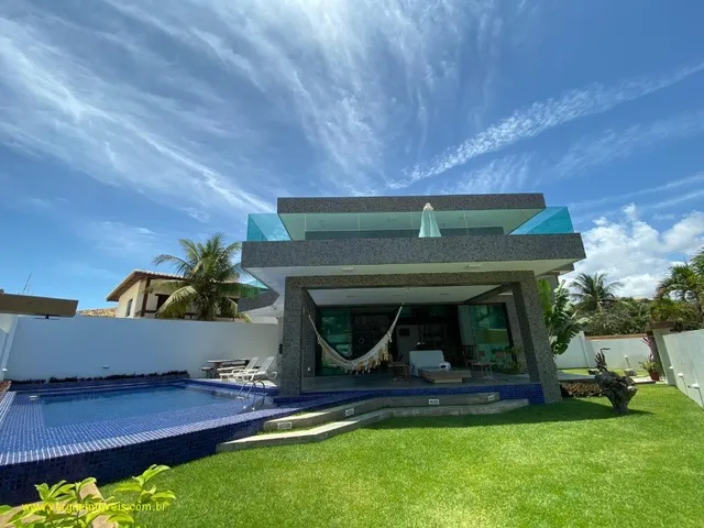 Imagem 11: Com ambientes amplos e modernos essa casa duplex vista mar com quatro suítes e espaço