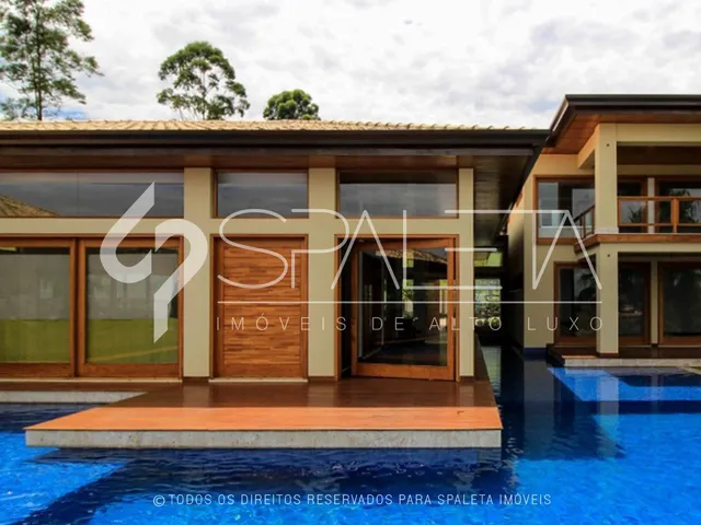 Imagem: A casa possui 5 Dormitórios, 5 Suítes, 6 Banheiros, 6