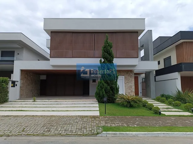 Imagem: A casa em condomínio possui 5 Dormitórios, 5 Suítes, 7