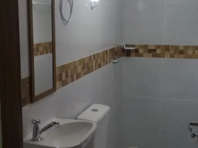 Imagem 13: Refúgio Perfeito com Piscina e Churrasqueira Perto do Mar