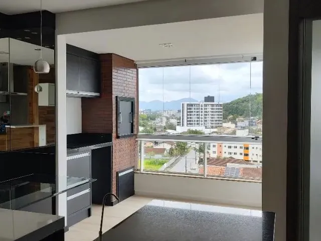 Imagem: O apartamento possui 2 Dormitórios, 1 Suíte, 2 Banheiros,