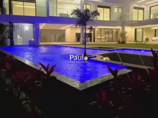 Imagem: A casa em condomínio possui 4 Dormitórios, 4 Suítes, 5
