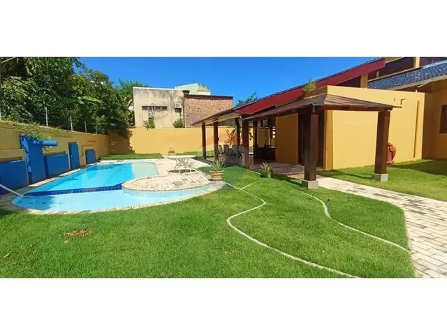 Imagem: A casa possui 3 Dormitórios, 3 Suítes, 5 Banheiros,
