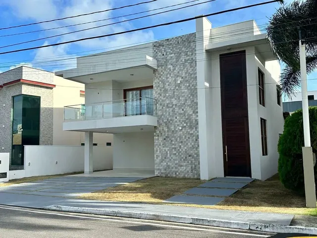 Imagem: A casa em condomínio possui 4 Dormitórios, 4 Suítes, 5 Banheiros
