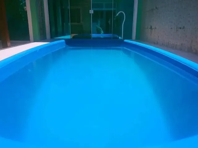 Imagem: A casa possui 4 Dormitórios, 3 Banheiros, 3 Vagas na