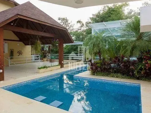Imagem: A casa em condomínio possui 4 Dormitórios, 4 Suítes, 2