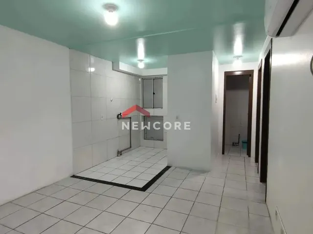 Imagem: O apartamento possui 2 Dormitórios, 1 Banheiro, 1 Vaga na