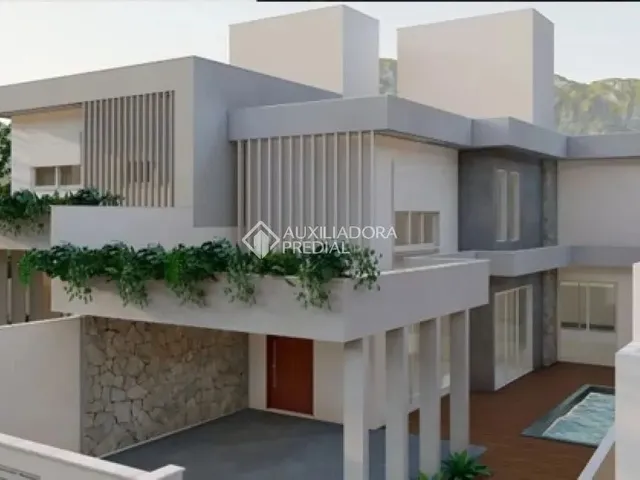 Imagem: A casa possui 3 Dormitórios, 3 Suítes, 4 Banheiros, 2