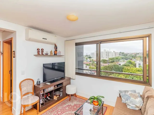 Imagem: O apartamento possui 2 Dormitórios, 1 Suíte, 3 Banheiros,