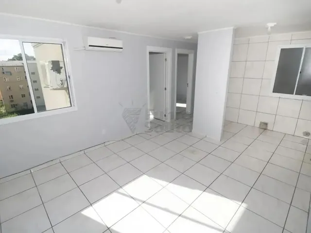 Imagem: O apartamento possui 2 Dormitórios, 1 Banheiro, Acomodam