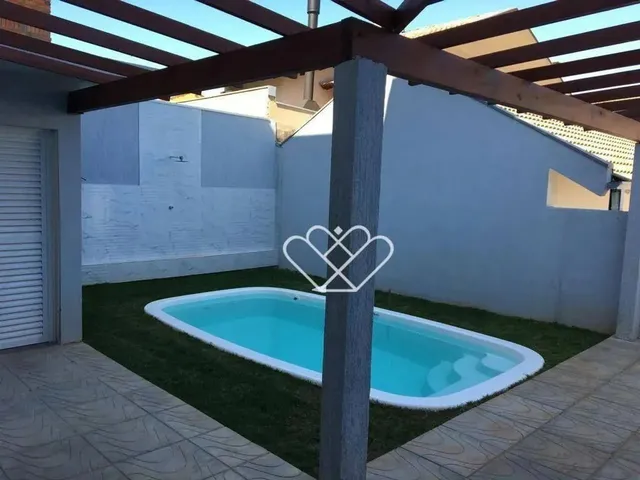 Imagem 11: Casa Nova com Piscina, Área Gourmet e Energia Solar: Conforto e Sustentabilidade em Cada