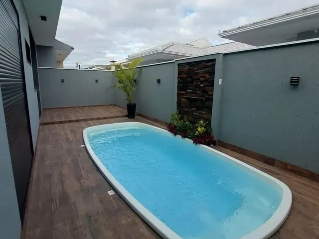 Imagem 11: Casa com 3 Dormitórios Sendo Uma Suíte, com Piscina.