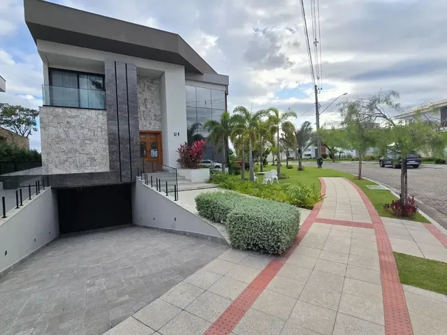 Imagem: A casa em condomínio possui 5 Dormitórios, 5 Suítes, 5