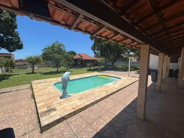 Imagem: A casa possui 3 Dormitórios, 4 Banheiros, Acomodam 14