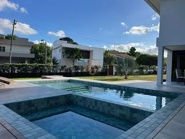 Imagem: A casa em condomínio possui 4 Dormitórios, 4 Suítes, 5