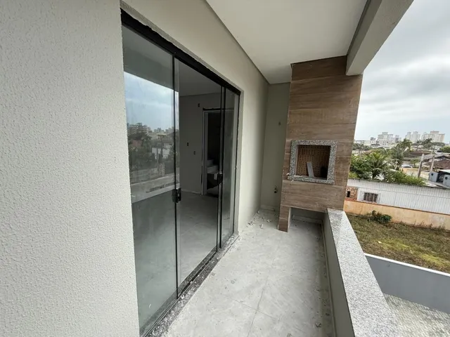 Imagem 9: Apartamento de dois dormitórios, sendo uma suíte, sacada com churrasqueira e uma vaga